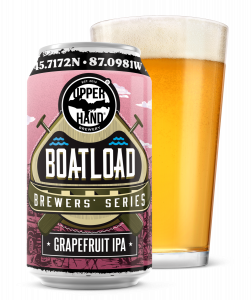 A pink can of beer labeled Boatload Brewer Series Grapefruit with a pint glass full of it behind the can