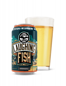 An off-blue/orange can of beer labeled Laughing Fish with a pint glass full of it behind the can